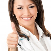 Doctor with thumbs up gesture, isolated